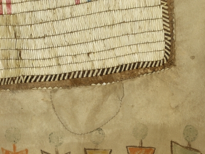 1893.67.1 - detail showing a patch which has been applied to the garment
