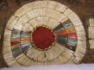 1893.67.4 - a close-up of the rosette design on the front of the garment