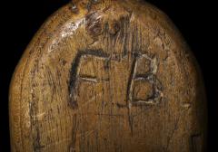 1910.42.15 F B carved into bat