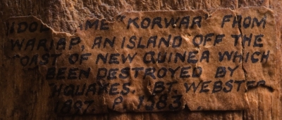 Label from back of New Guinea figure