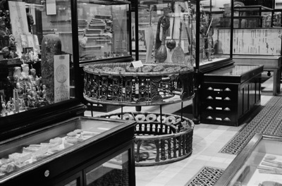 1886.15.1 Burmese wooden frame and gongs in the Court of the Pitt Rivers Museum. Donated by M.V. Portman