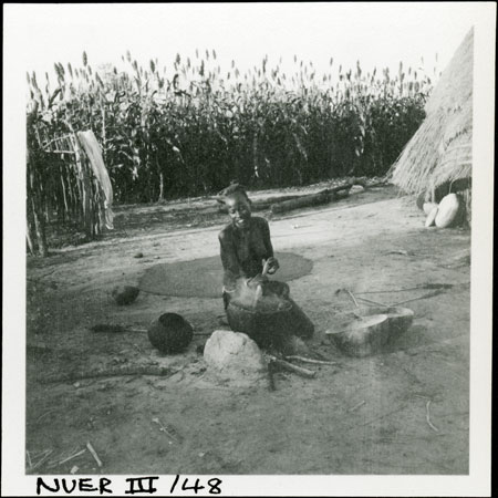 A Nuer woman cooking