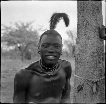 Mandari youth with feather in hair