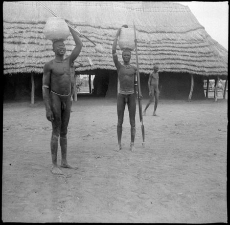 Mandari men with spears and baskets