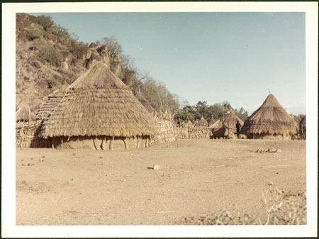 Mandari homestead next to rocky outcrop