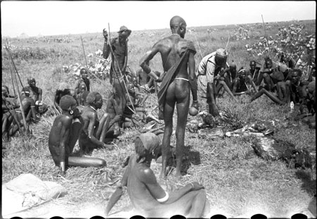 Nuer porters dividing meat