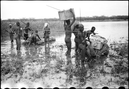 Nuer porters rafting baggage