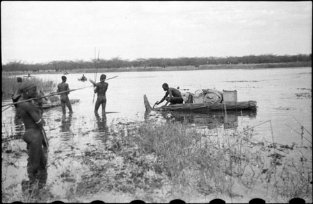 Nuer porters rafting baggage