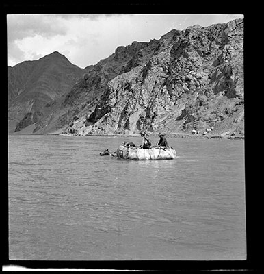Men in a coracle crossing the river Tsangpo at Nyapso