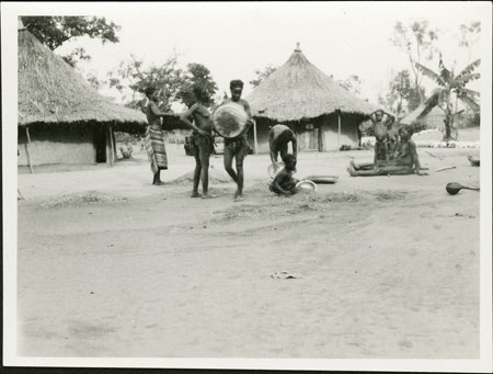 Zande women winnowing eleusine