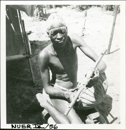 Nuer youth playing harp