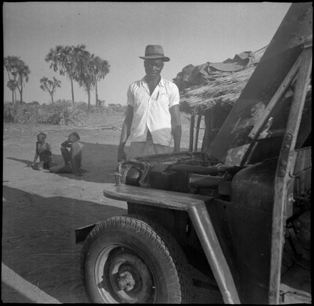 Mandari youth with jeep