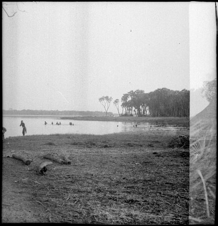 Mandari group bathing in the Nile