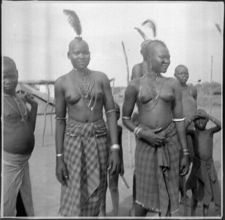 Mandari girls wearing beads and plumes